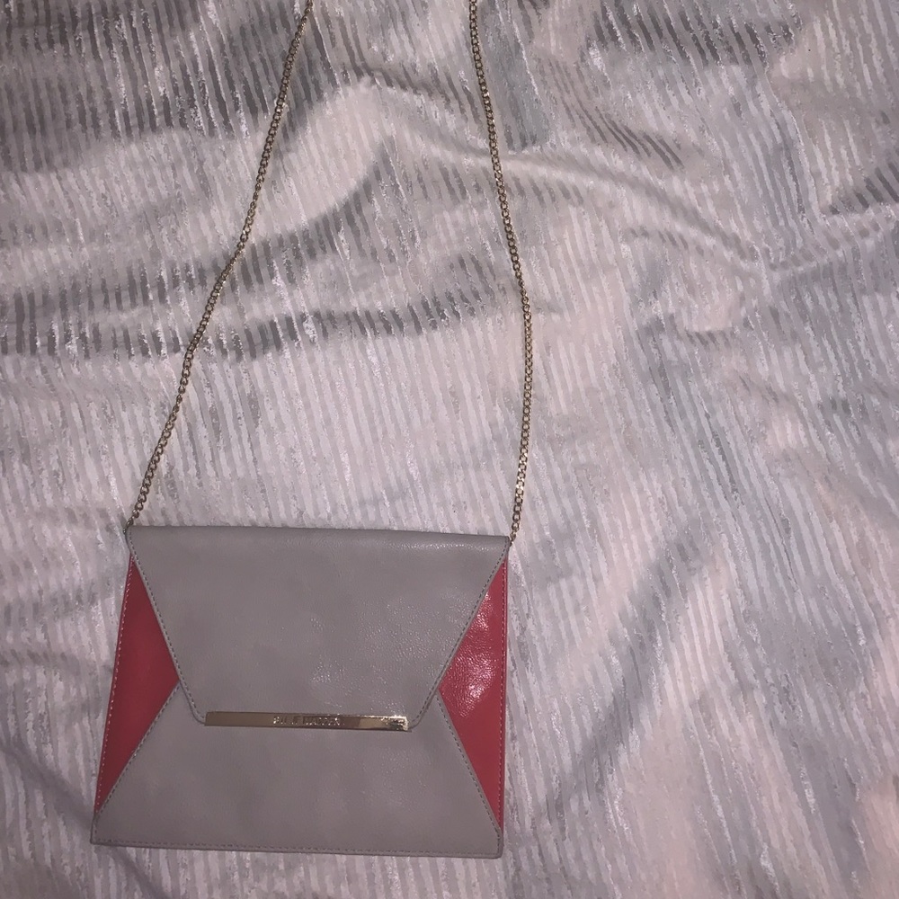 Gray Michael Kors purse with pink detail